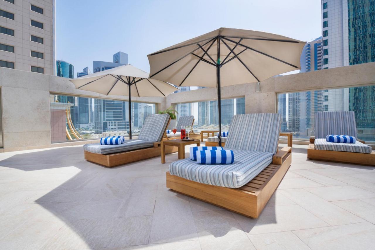 Wyndham Grand Doha West Bay Beach Εξωτερικό φωτογραφία The pool deck at the hotel